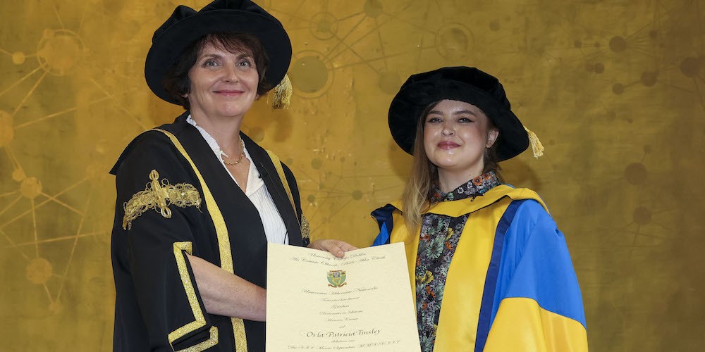 Orla Tinsley '20 receives doctorate from UCD President Orla Feely. © Fennel Photography