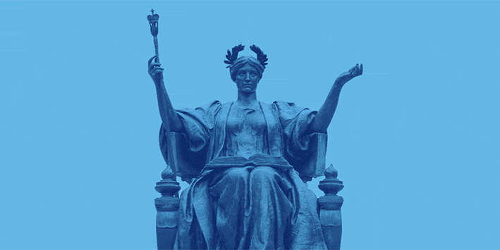 Animated gif of Alma MAter wearing a graduation cap.