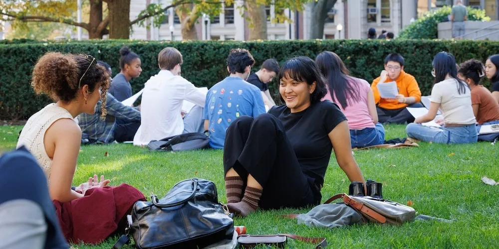 students sitting outside