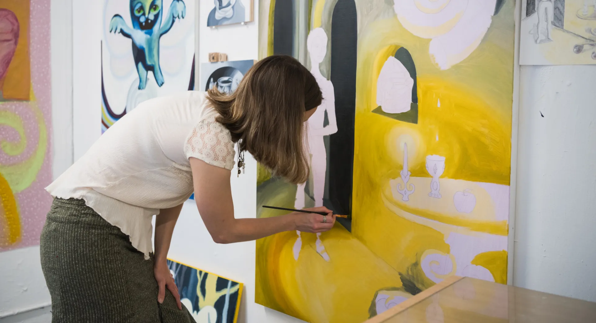 an artist paints on canvas