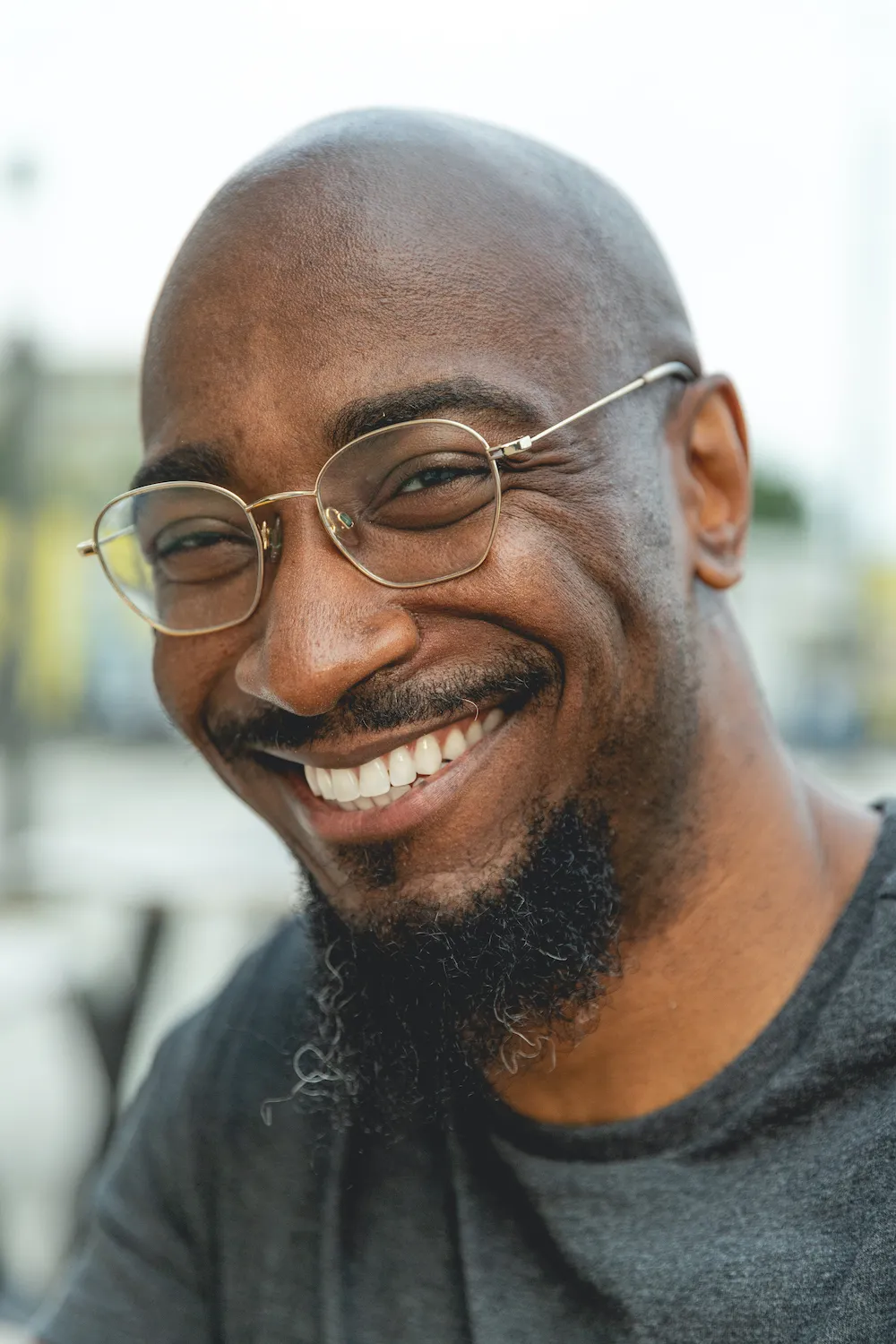 poet phillip b williams - african american man wearing glasses smiling at camera