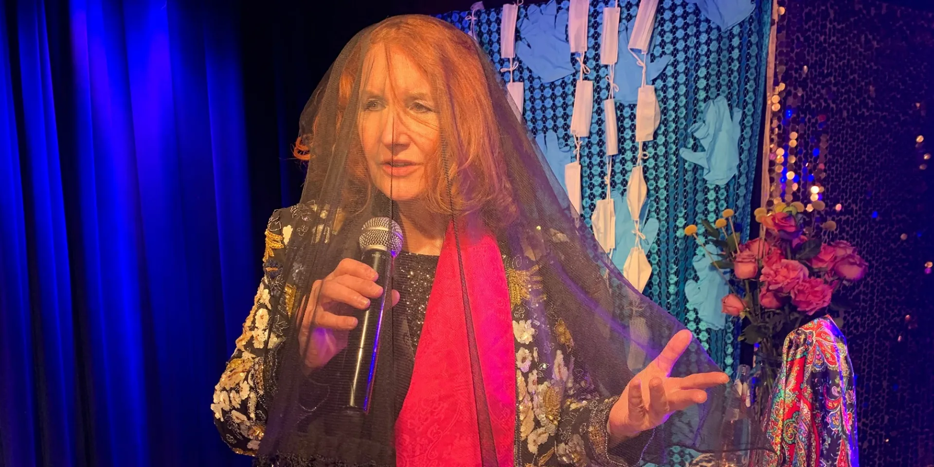 photo of Karen Finley holding a microphone