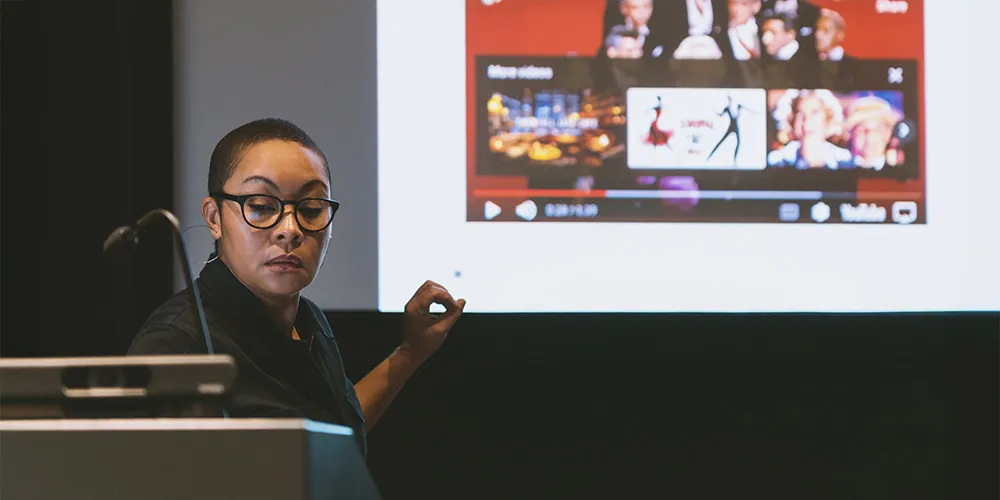a professor teaches from a podium