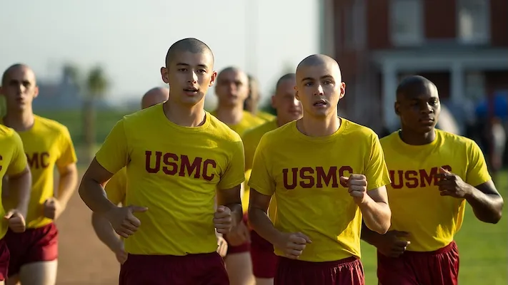 a group of men in uniform run outside