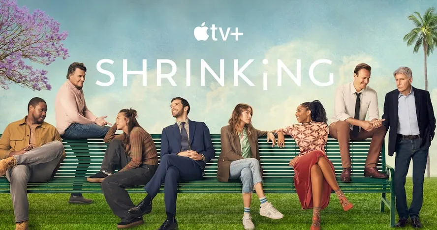a group of people sit on a bench