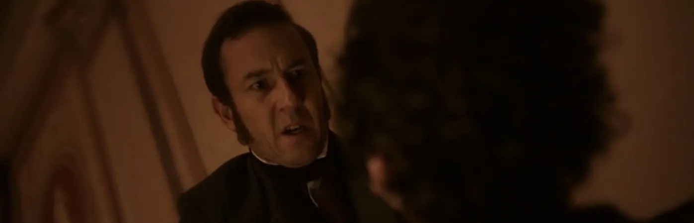 Two men speaking with intensity.