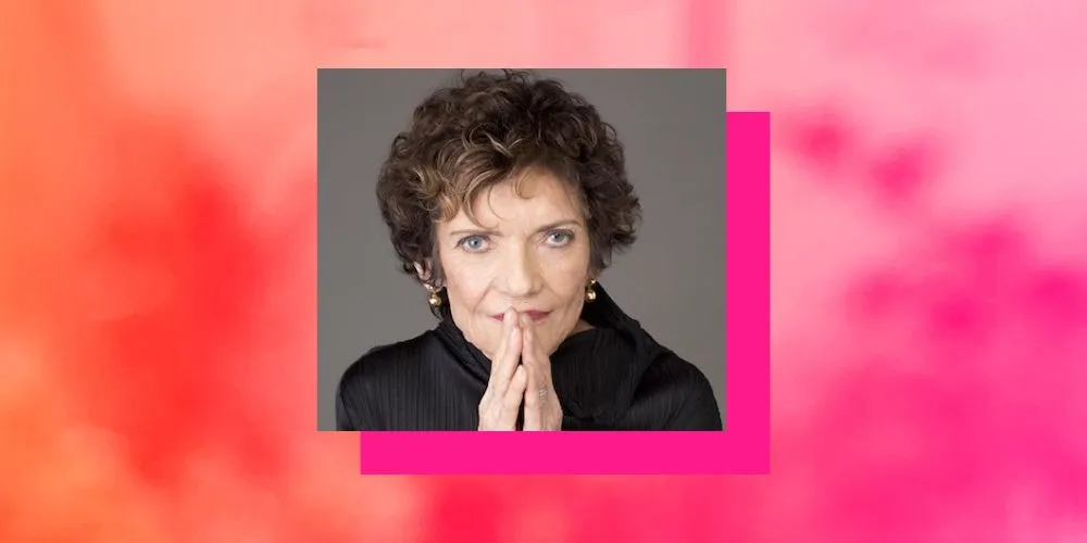 Headshot of Anna Rabinowitz on pink background