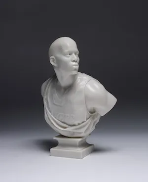 A bust of a Black figure in a Lakers jersey