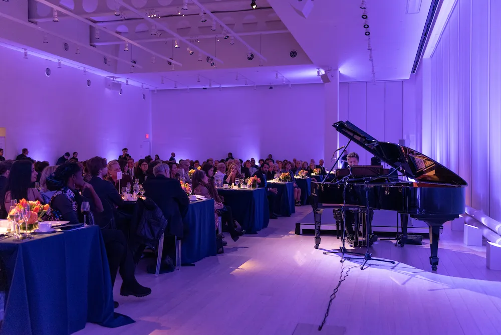 A man performs at a piano