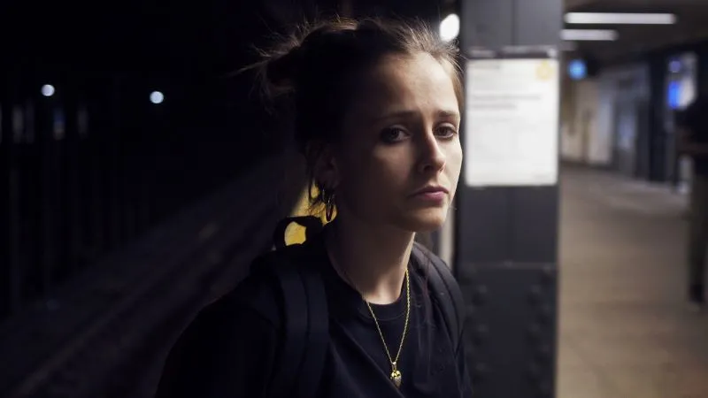Woman dressed in black in the subway