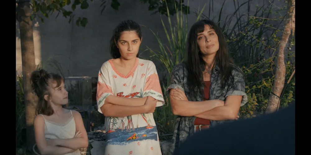 Three women with their arms crossed