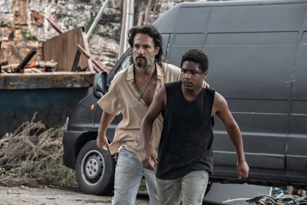 Two men walking away from a black van