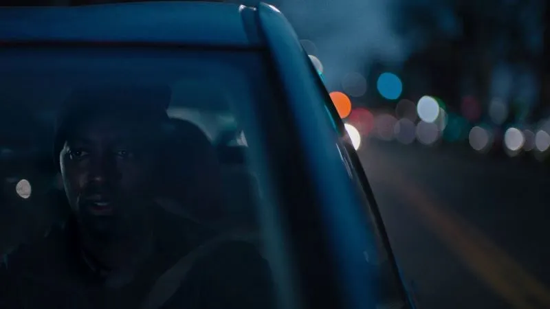 Person driving a car at night