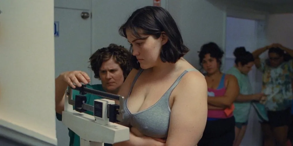 Woman being weighed