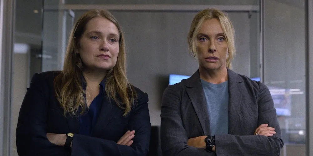 Two women with their arms crossed