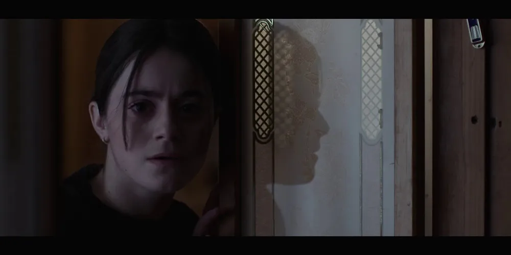 Little girl looking into room in still from 'Chosen'