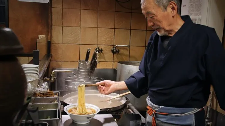 man cooking in home kitchen