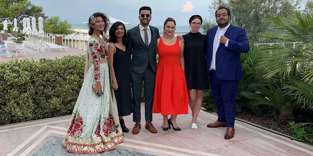 Group photo at a seaside spot.