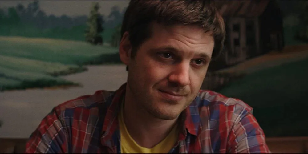 man in plaid shirt