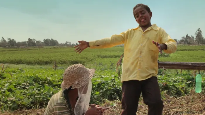 Two kids in a field.