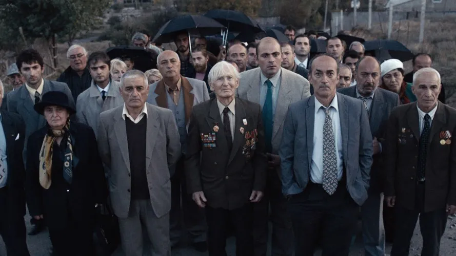 A group of men stands in formation.