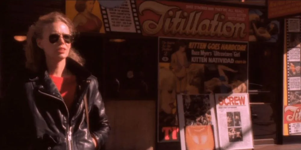 character in leather jacker and sunglasses