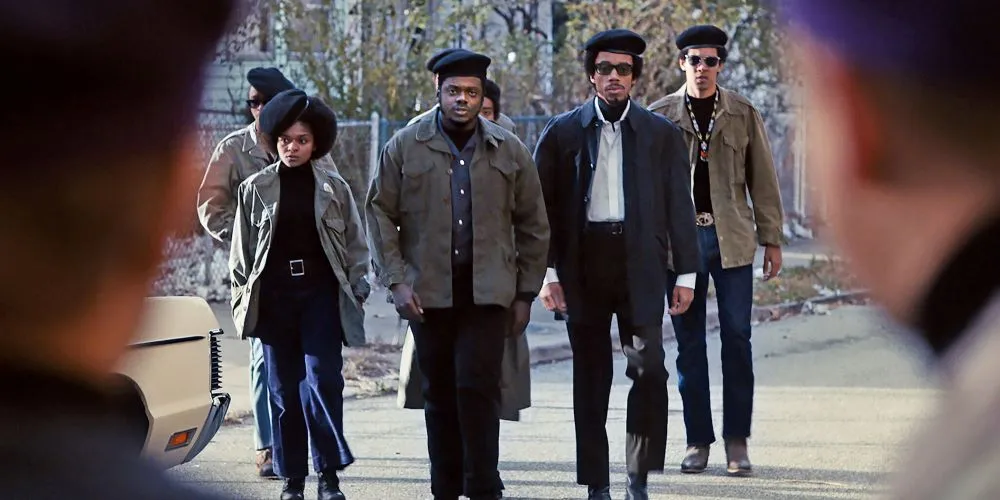 scene of multiple characters walking in street