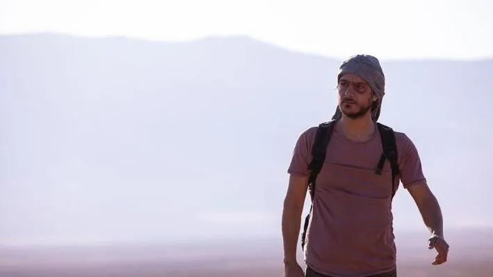 Still from 'Broken Keys'. A man walks in desolated environment.