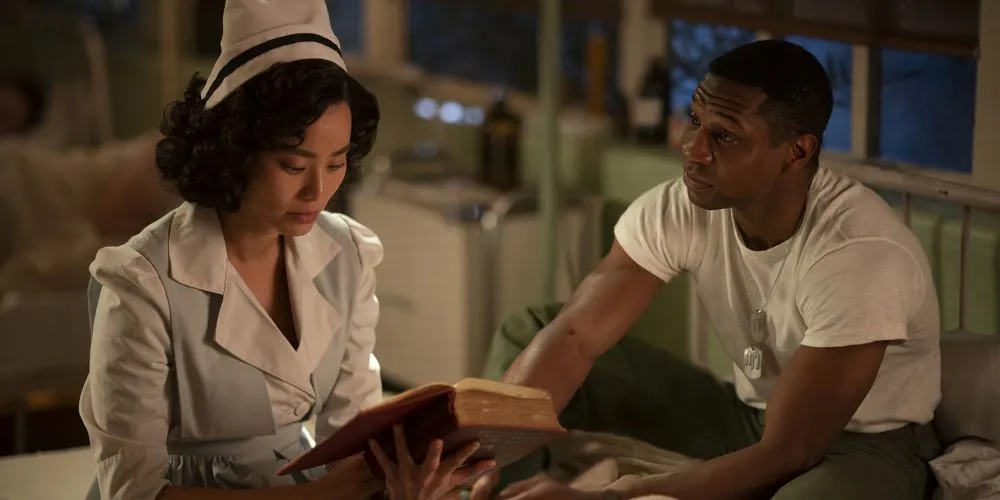 Soldier with army nurse holding an old book