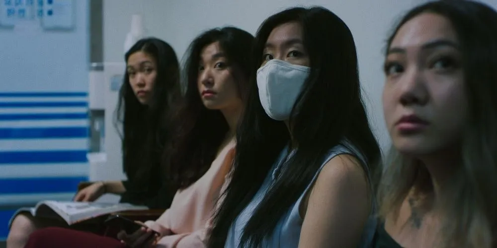 Still image from short film Mirror. 4 women look towards the camera.