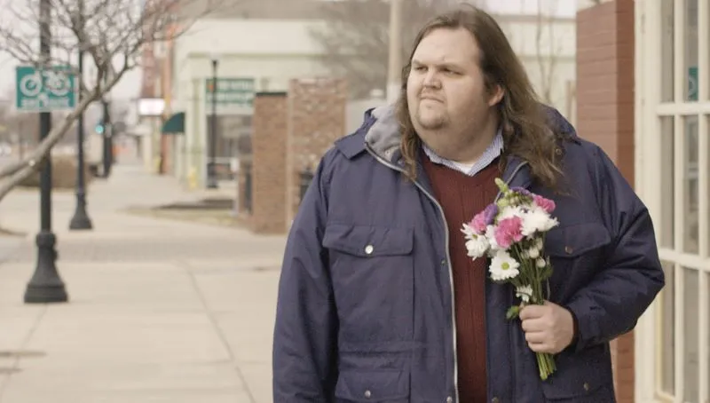 Man holding flowers
