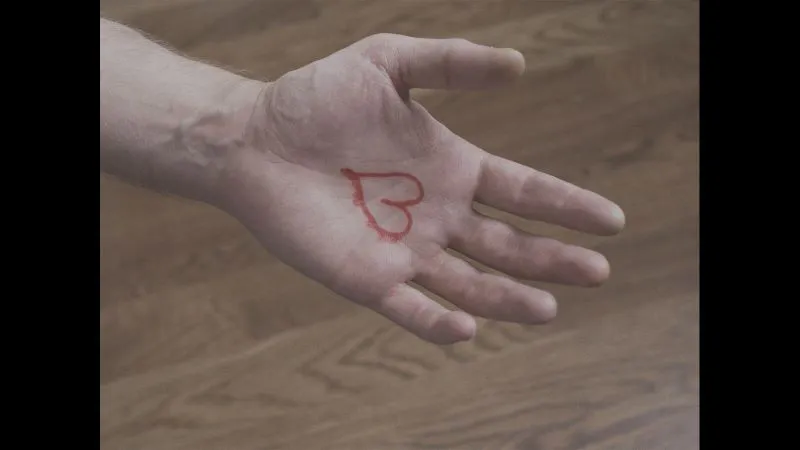 Hand with a heart drawn on the palm