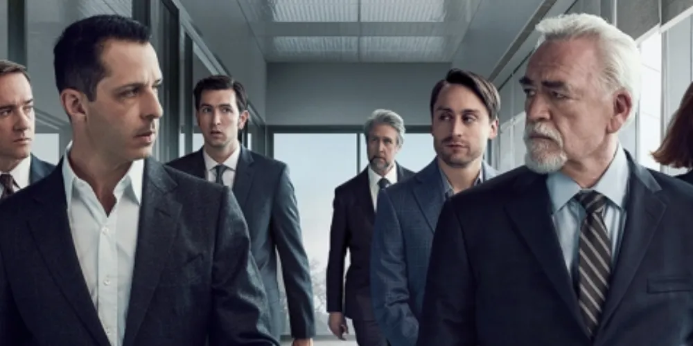 six people walking down a hallway looking at each other