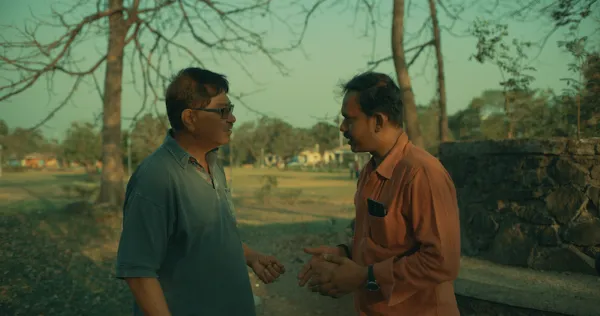 Two men talking outside