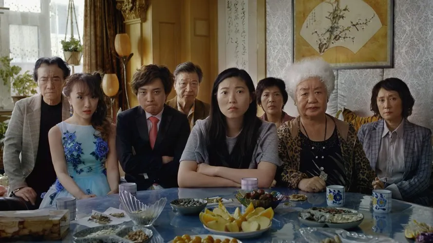 A group of people look towards camera.
