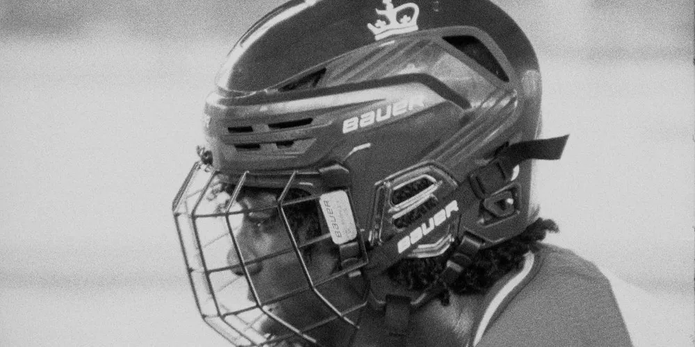 Man wears a helmet. 