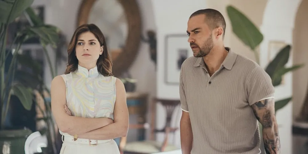 a man and woman stand next to each other