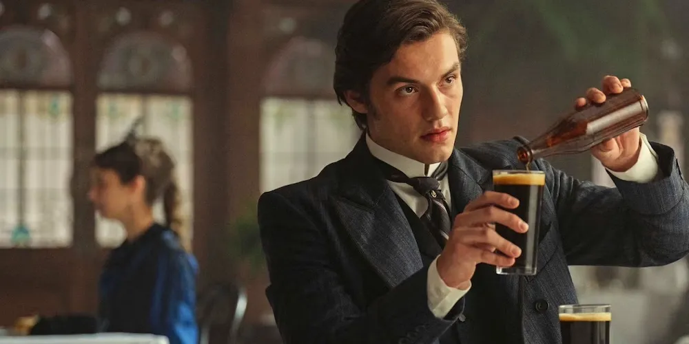 a man pours a beer