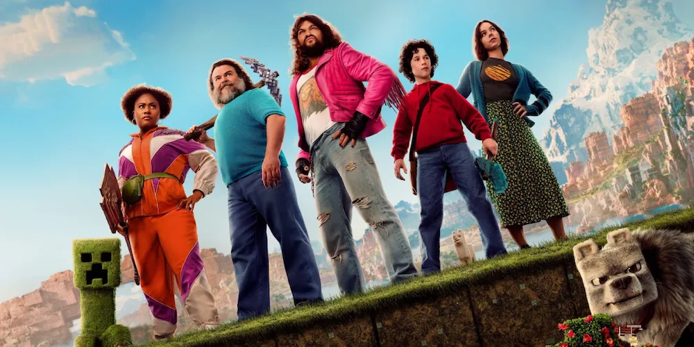 a group of people stand at a cliffside