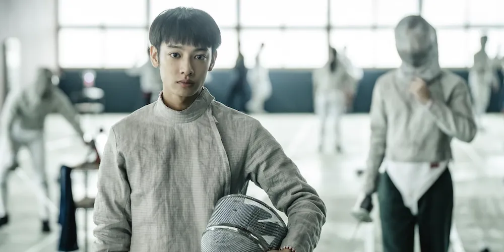 film still, boy in fencing outfit 