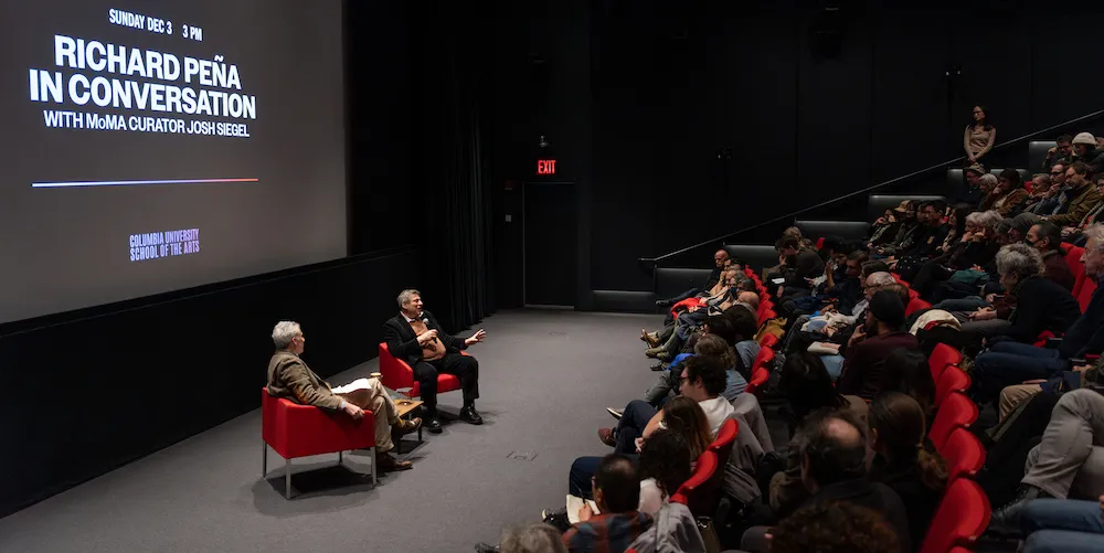 Professor Richard Peña in front of a packed house at the Richard Peña Selects Festival. 