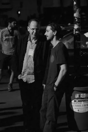 two men standing in parking lot