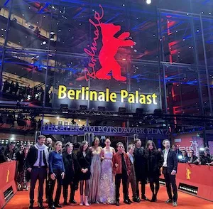 a group of people on the red carpet