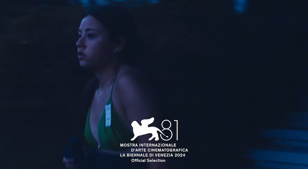 Young woman running outside in low light. 
