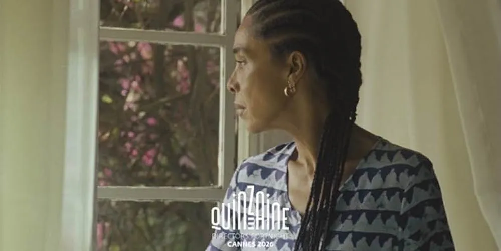 A women looks out a window. 