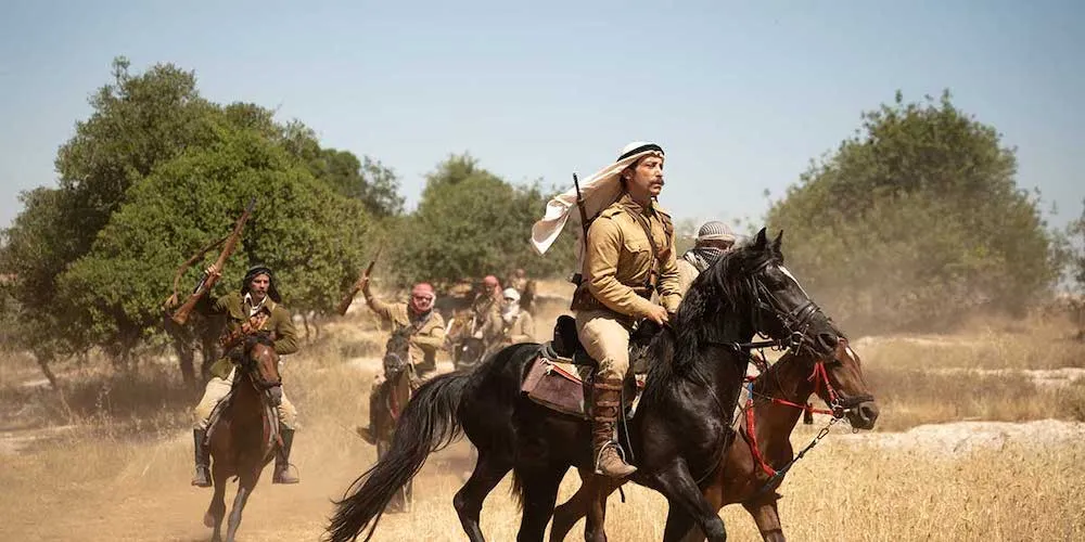 men on horseback carrying weapons