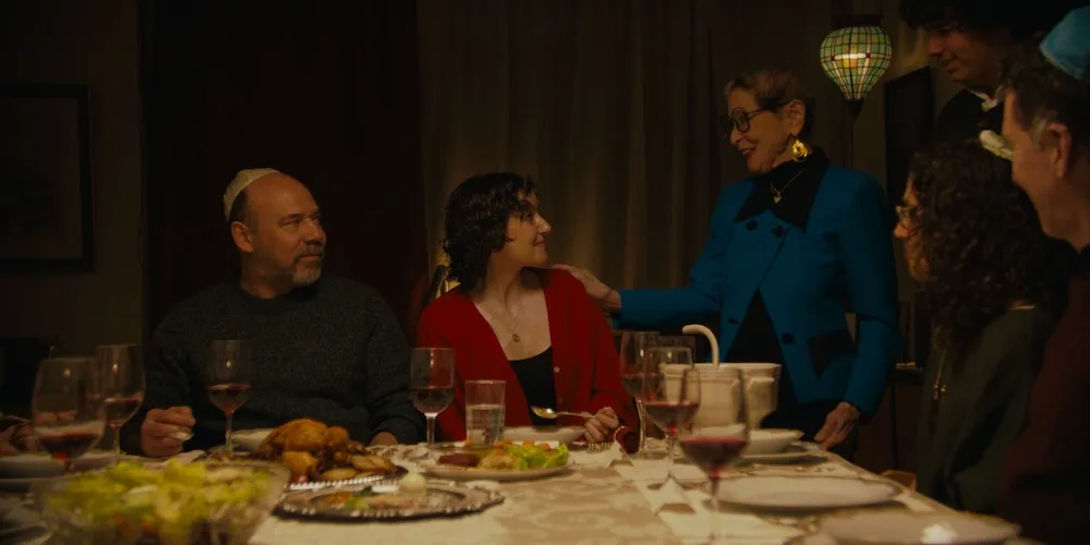 A group of people sit around a dinner table