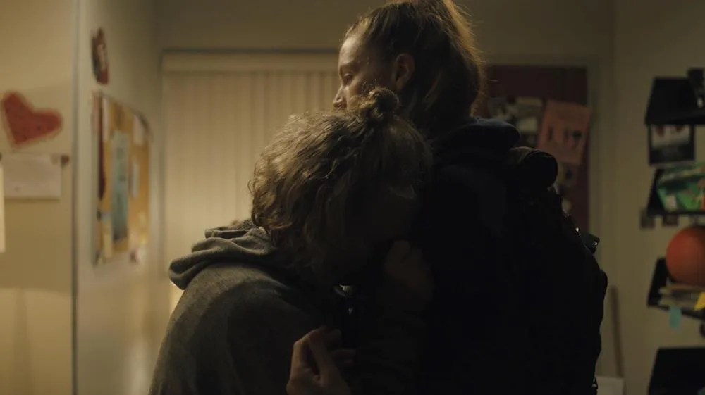 two people embrace