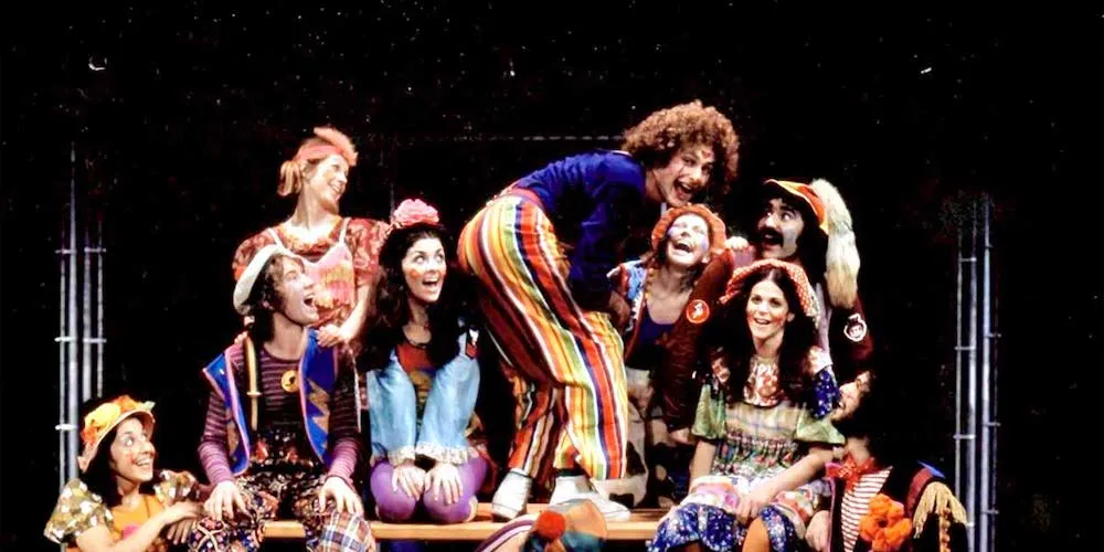 a group of people in costumes on stage