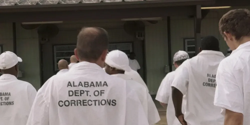 a group of incarcerated individuals in uniform
